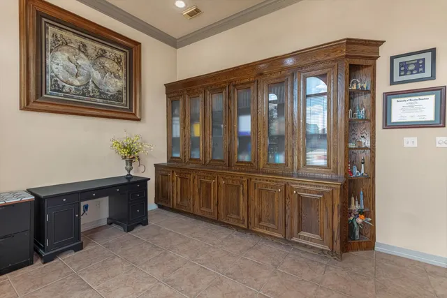 a view of workspace with furniture and window