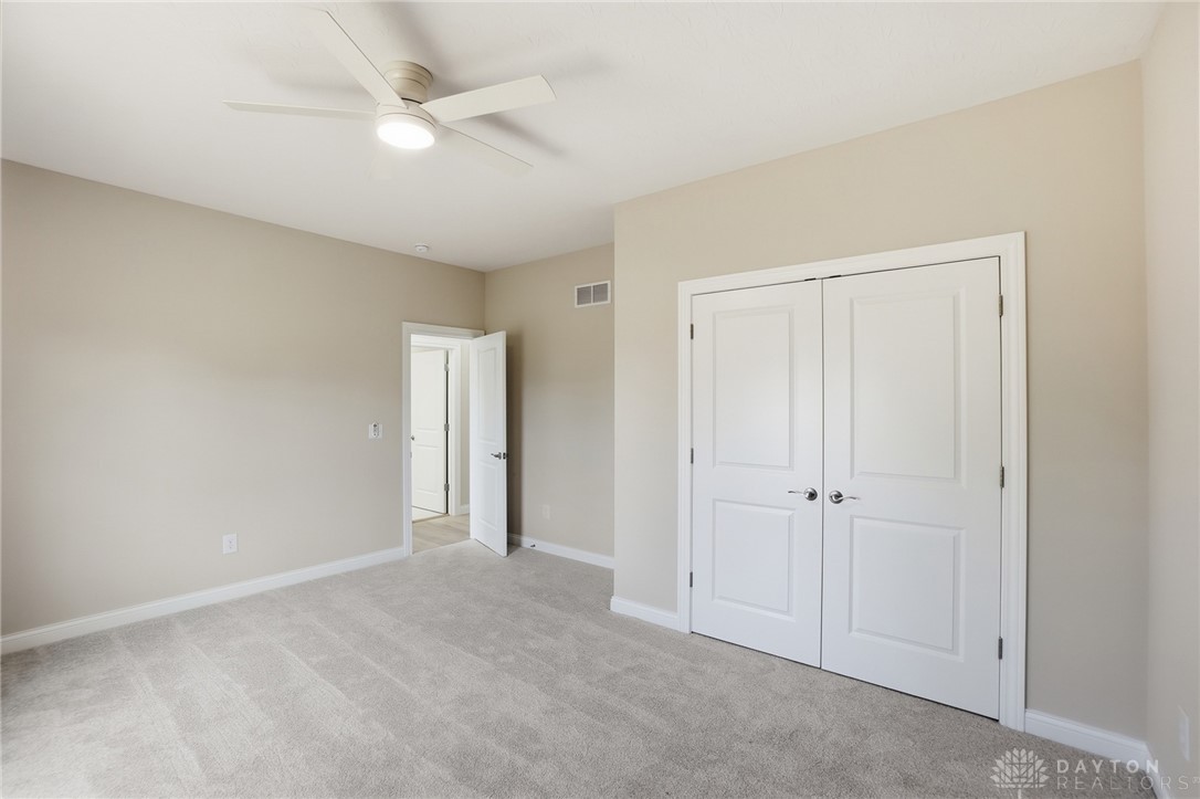 4600 Beal Road Franklin, OH 45005 - Photo 26 of 42 This spacious bedroom offers comfortable carpeting and a bright ceiling fan.