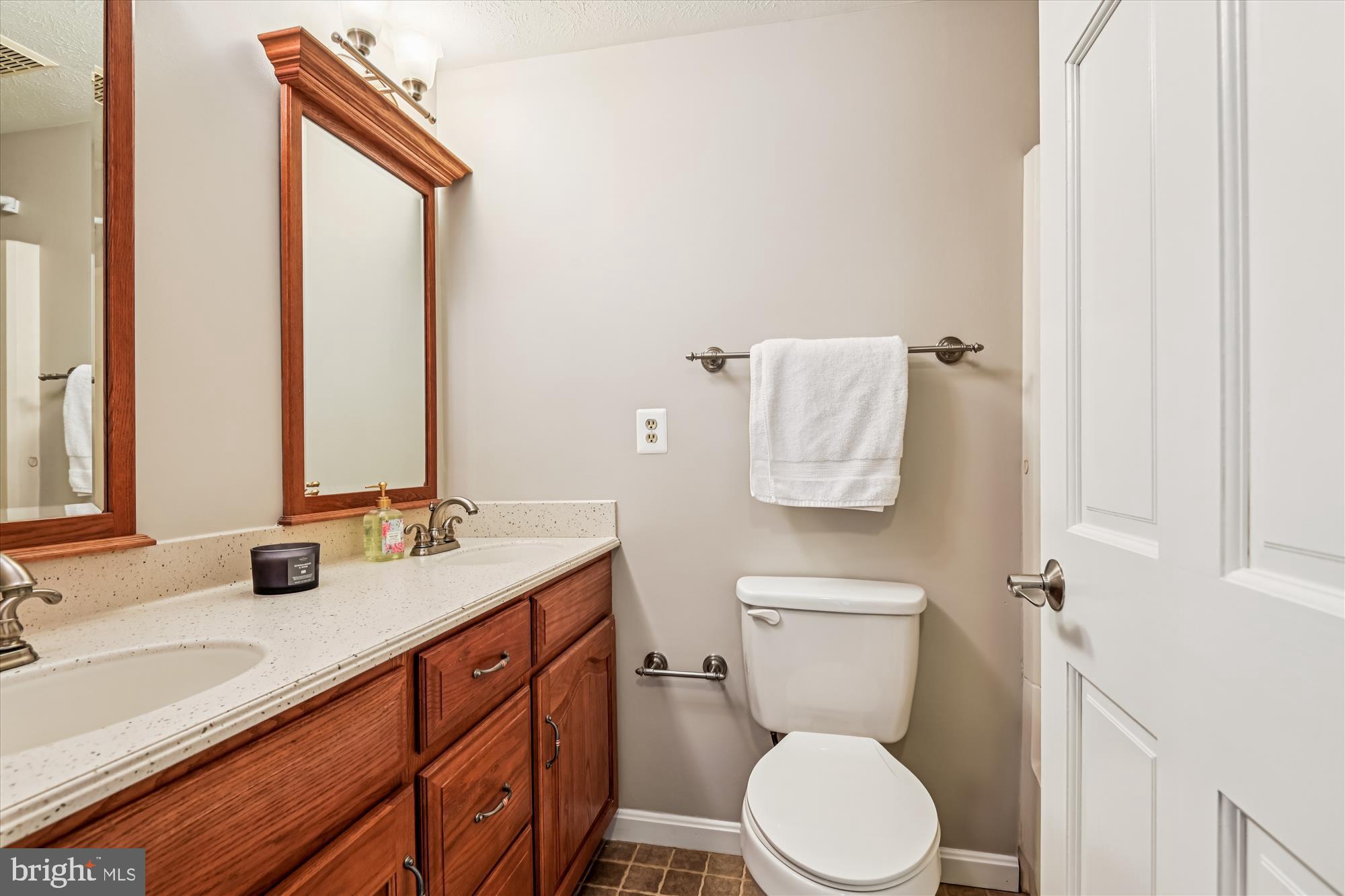 478 Bay Green Drive Arnold, MD 21012 - Photo 20 of 42 a bathroom with a granite countertop toilet sink and mirror