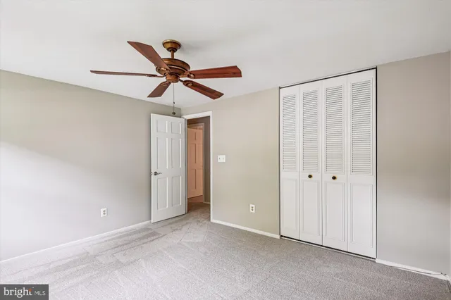 a view of a chandelier fan in a room