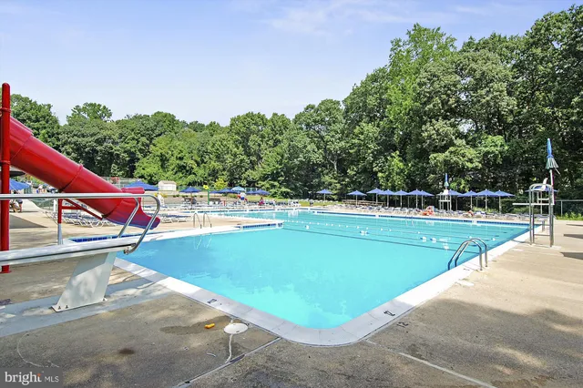 a view of a swimming pool with a patio