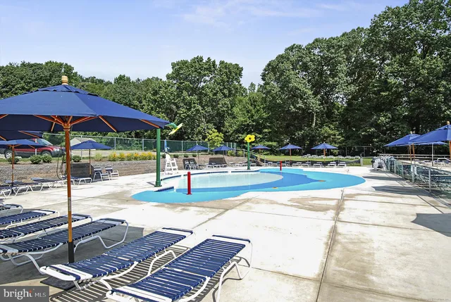 an outdoor sitting area with a table and chairs