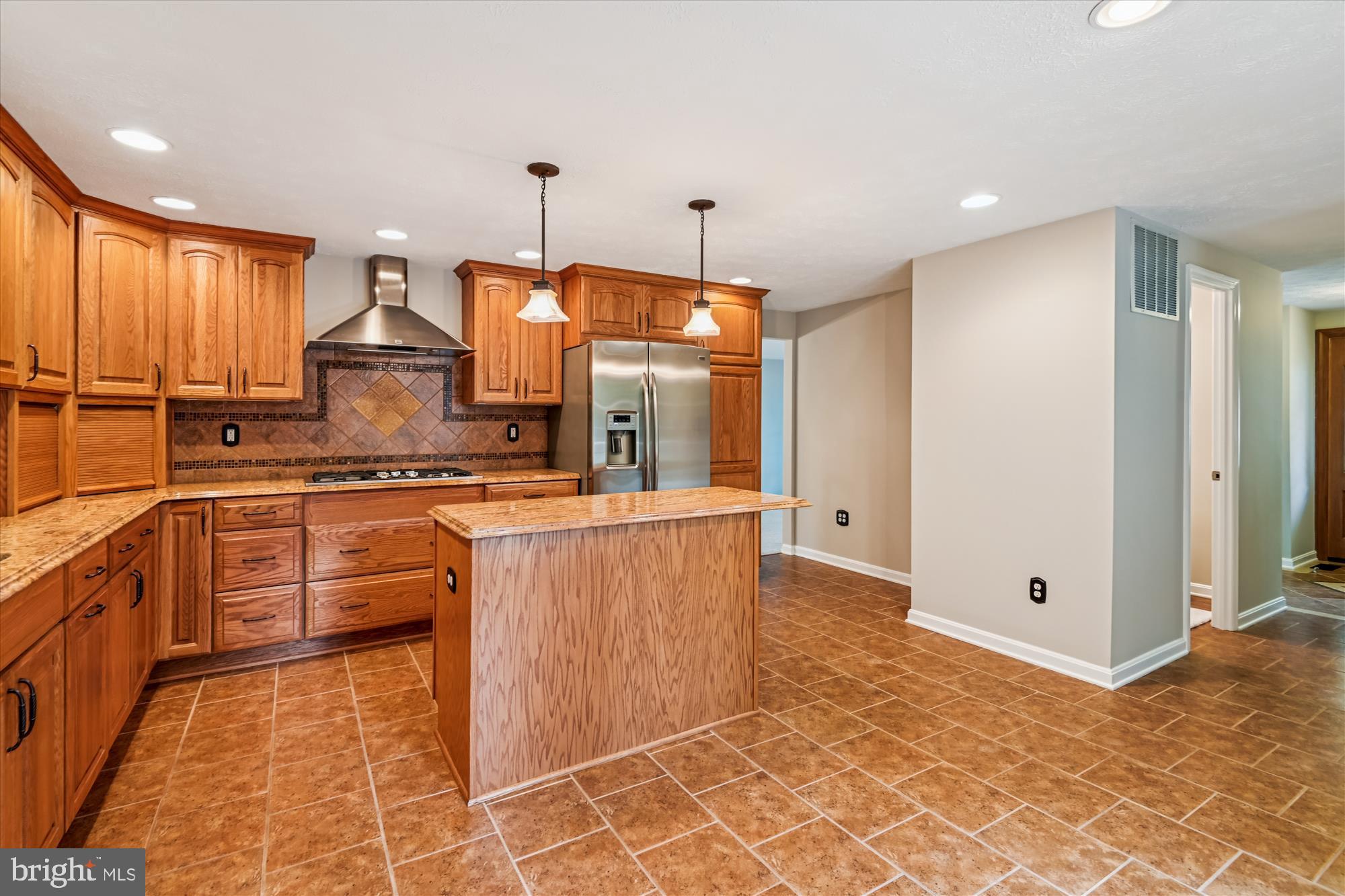 478 Bay Green Drive Arnold, MD 21012 - Photo 10 of 42 a kitchen with stainless steel appliances granite countertop a stove a sink and a refrigerator