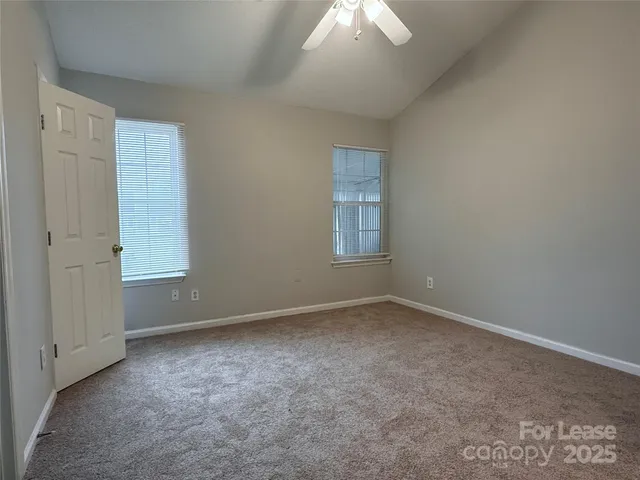 an empty room with a empty space and a window