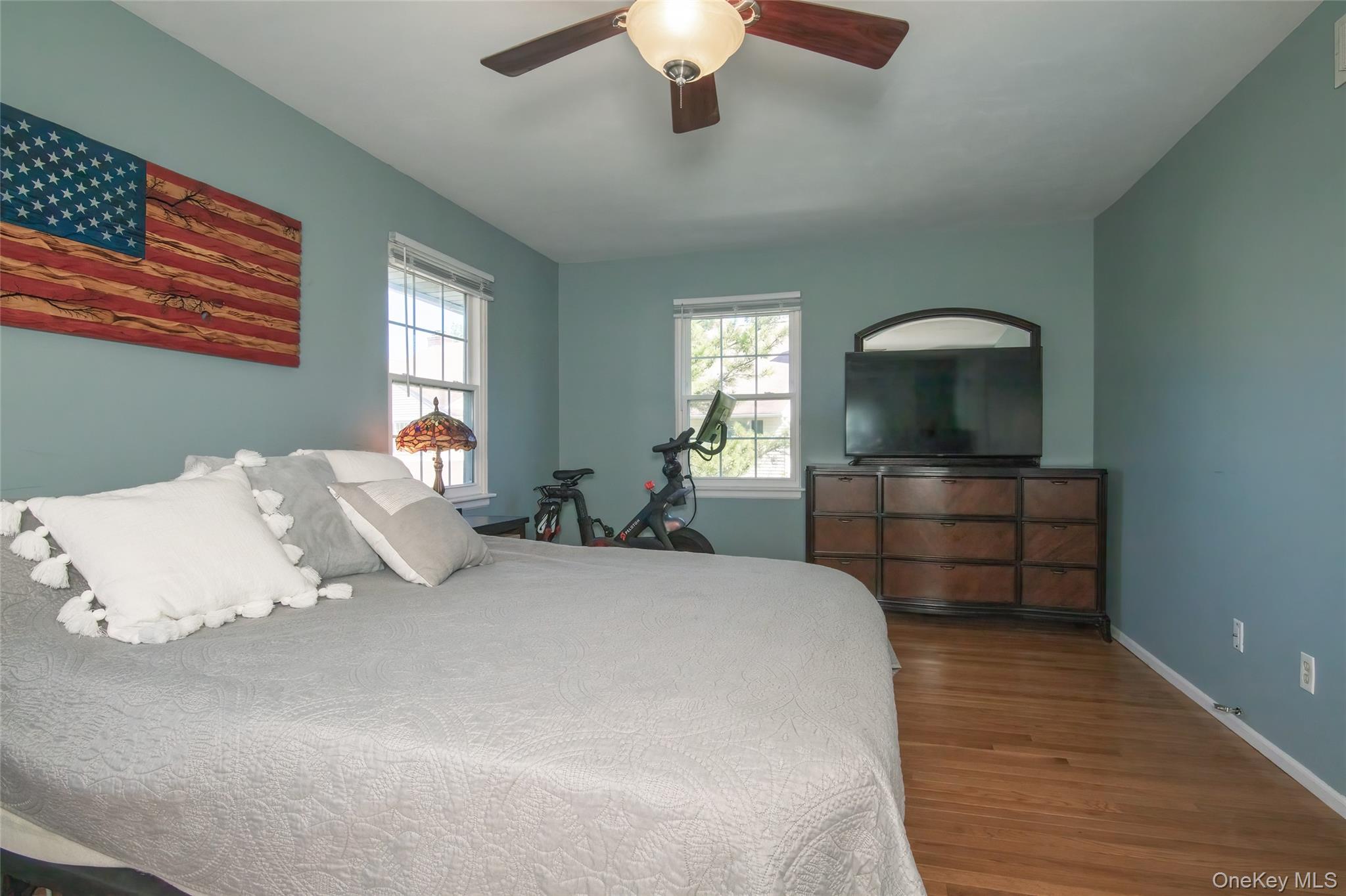 46 The Rise Warwick, NY 10990 - Photo 12 of 22 a bedroom with a bed and a chandelier