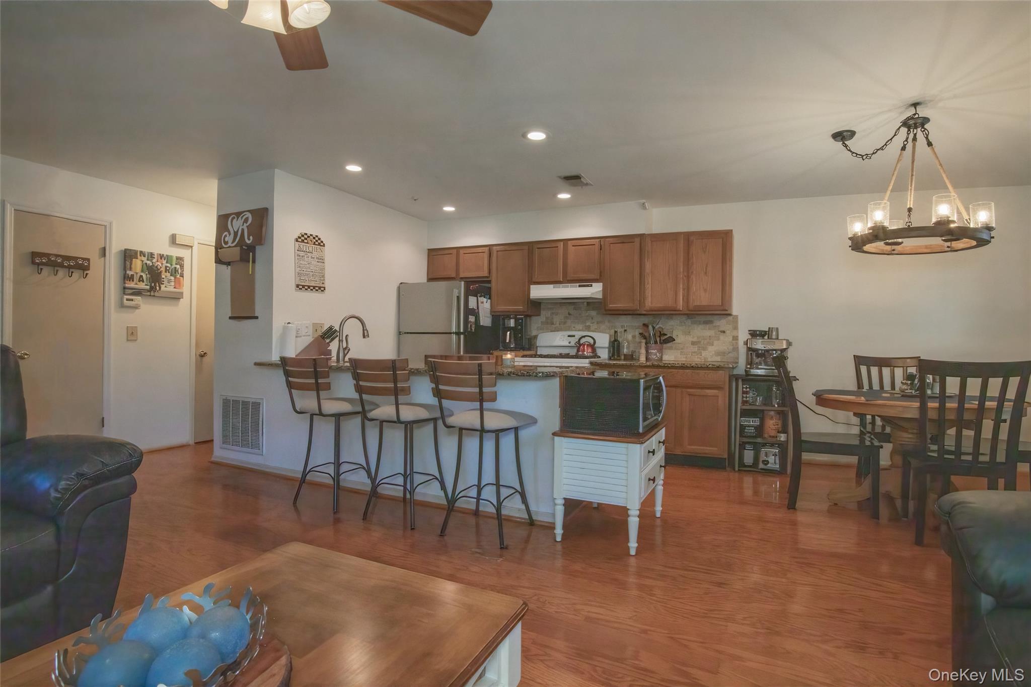 46 The Rise Warwick, NY 10990 - Photo 3 of 22 a living room with dining room and kitchen view
