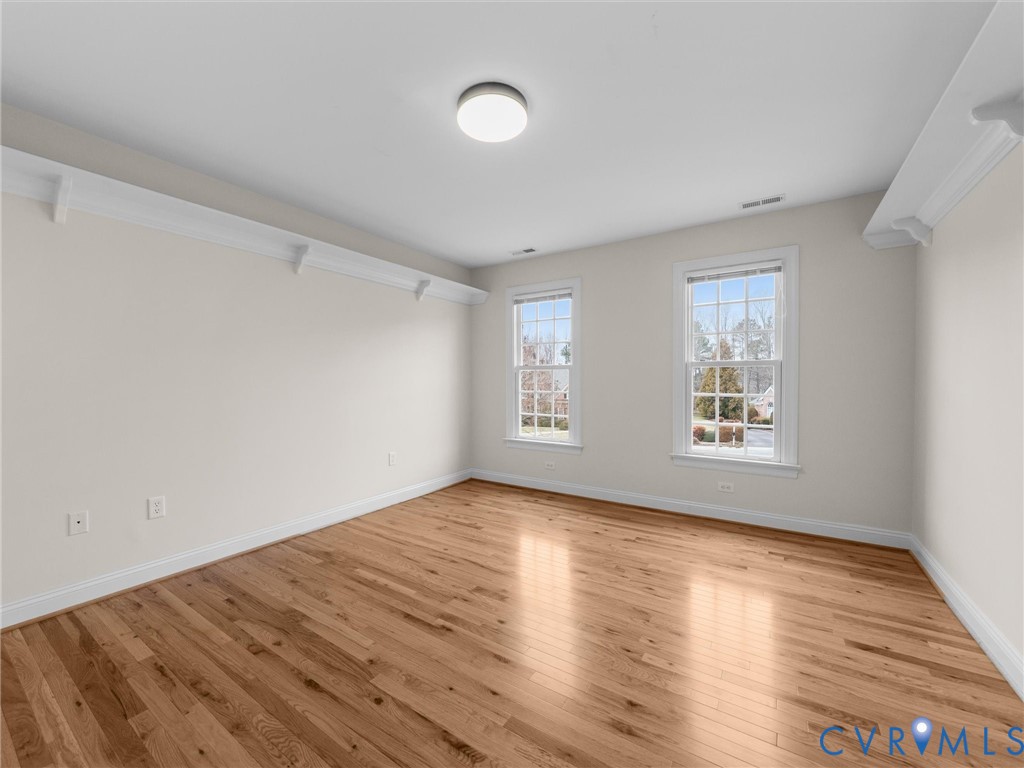 14335 Lander Road Midlothian, VA 23113 - Photo 54 of 70 an empty room with wooden floor and windows