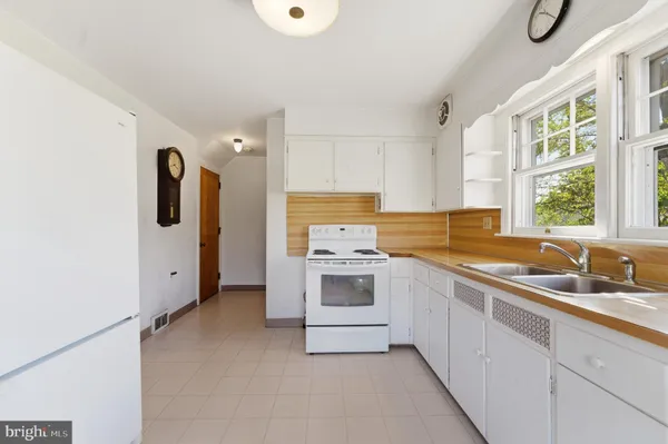 a kitchen with a stove and a sink
