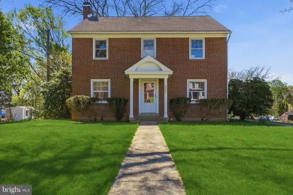 a front view of a house with yard