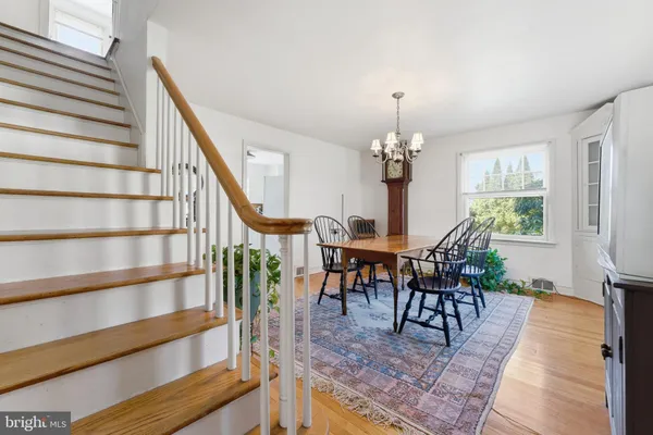 a view of a livingroom with furniture and stairs