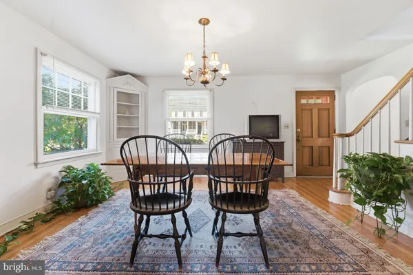 a view of a livingroom with furniture window and wooden floor