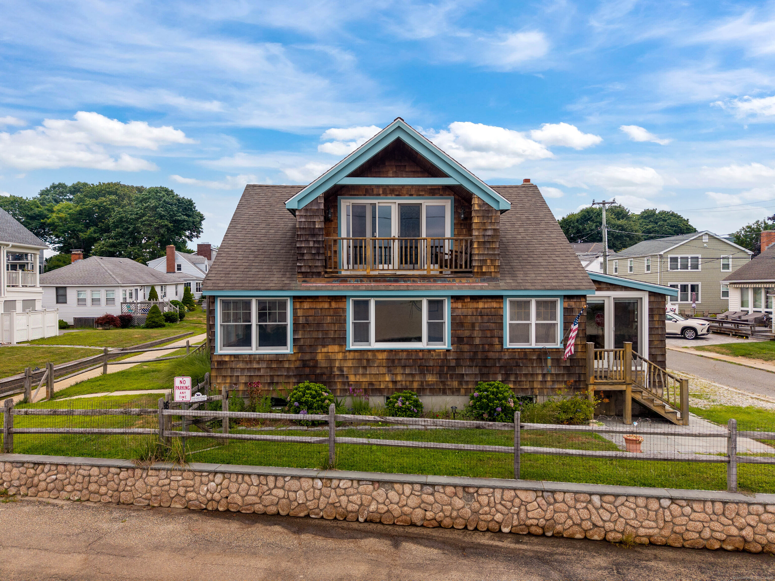 a front view of house with yard and green space