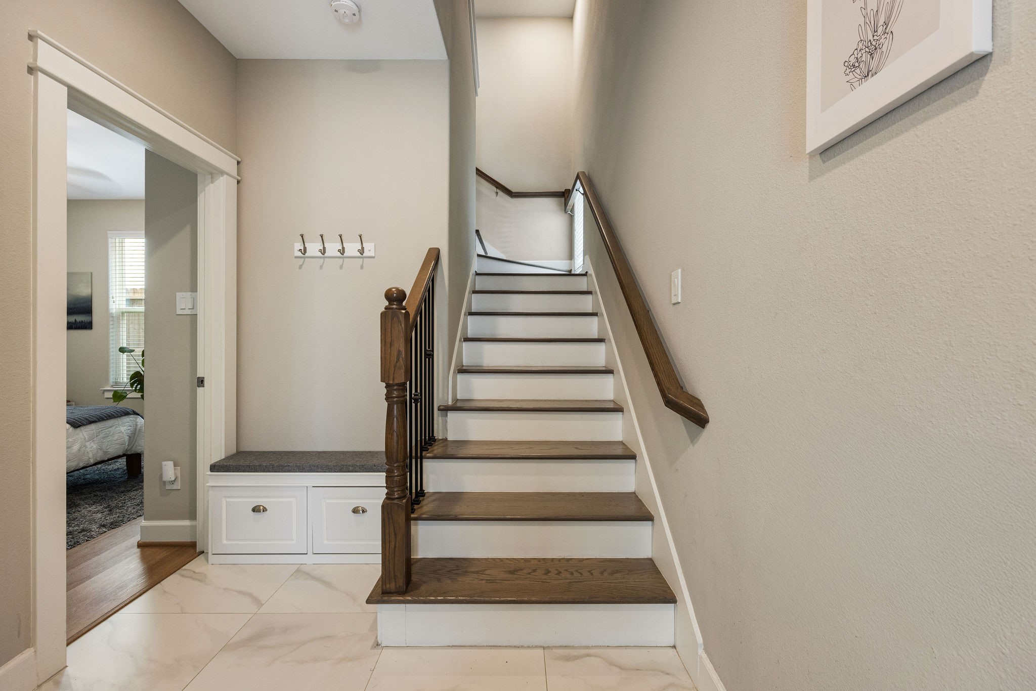 603 Link Road, Unit F Houston, TX 77009 - Photo 15 of 16 Welcoming entry with wood stairs, built-in storage, and no carpet anywhere.