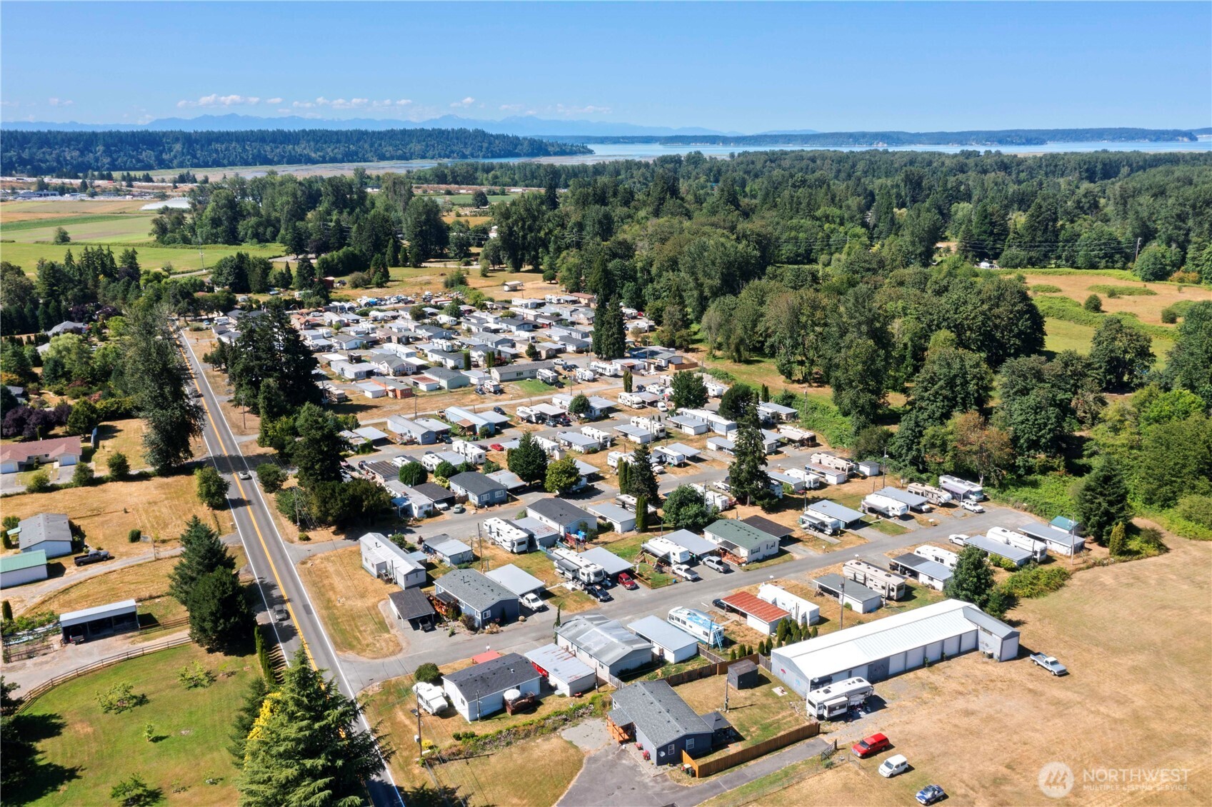10900 Kuhlman Road Southeast, Unit 4 Olympia, WA 98513 - Photo 11 of 11 an aerial view of residential houses with outdoor space