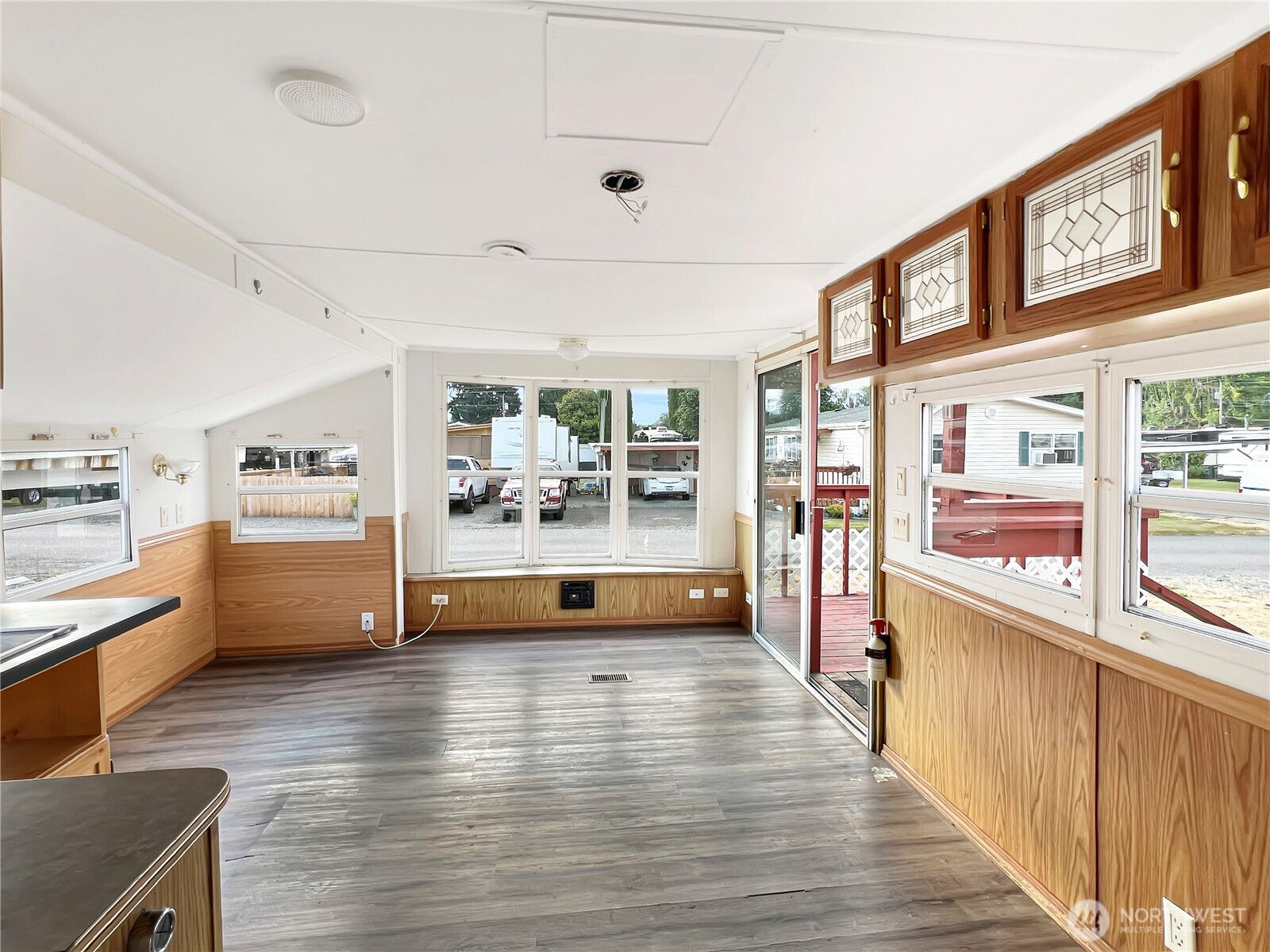 10900 Kuhlman Road Southeast, Unit 4 Olympia, WA 98513 - Photo 3 of 11 a view of kitchen with stainless steel appliances cabinets and wooden floor