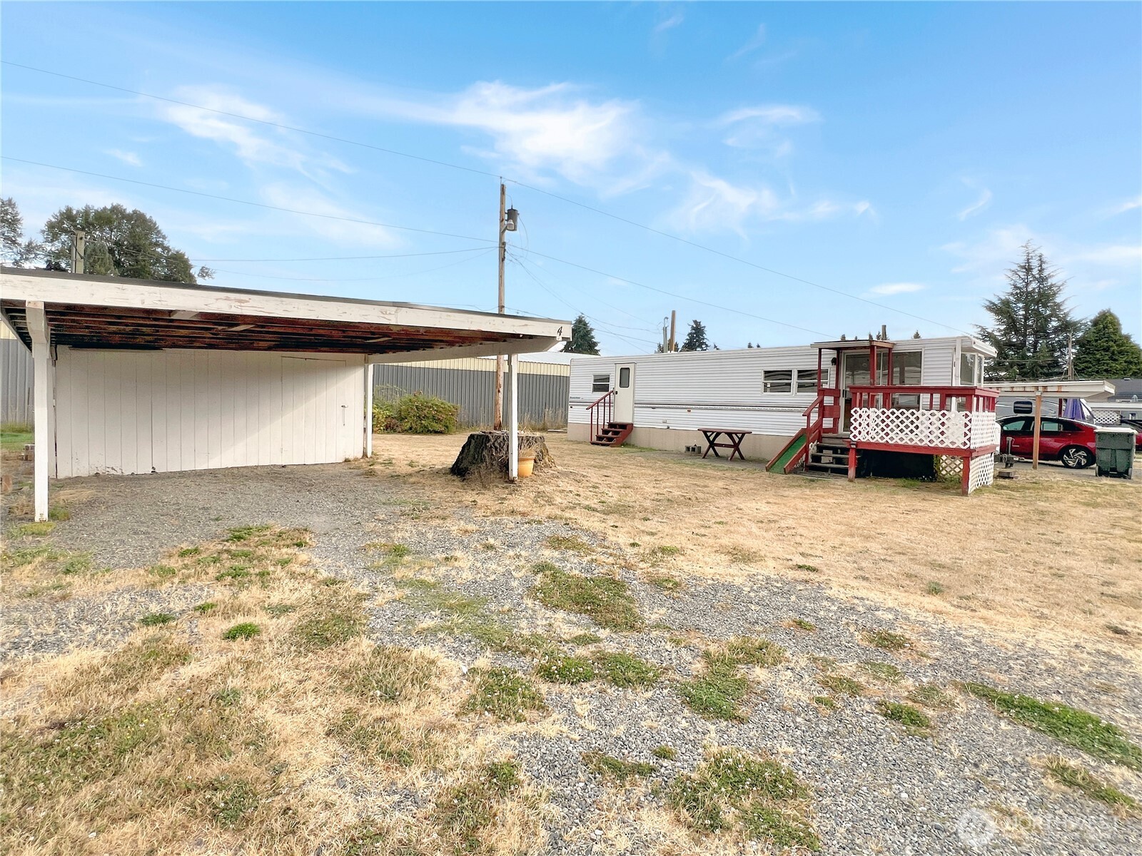 10900 Kuhlman Road Southeast, Unit 4 Olympia, WA 98513 - Photo 10 of 11 a car parked in front of a house