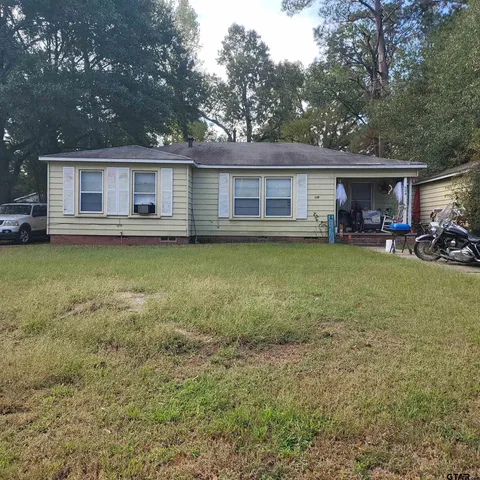 a view of a house with pool table and chairs