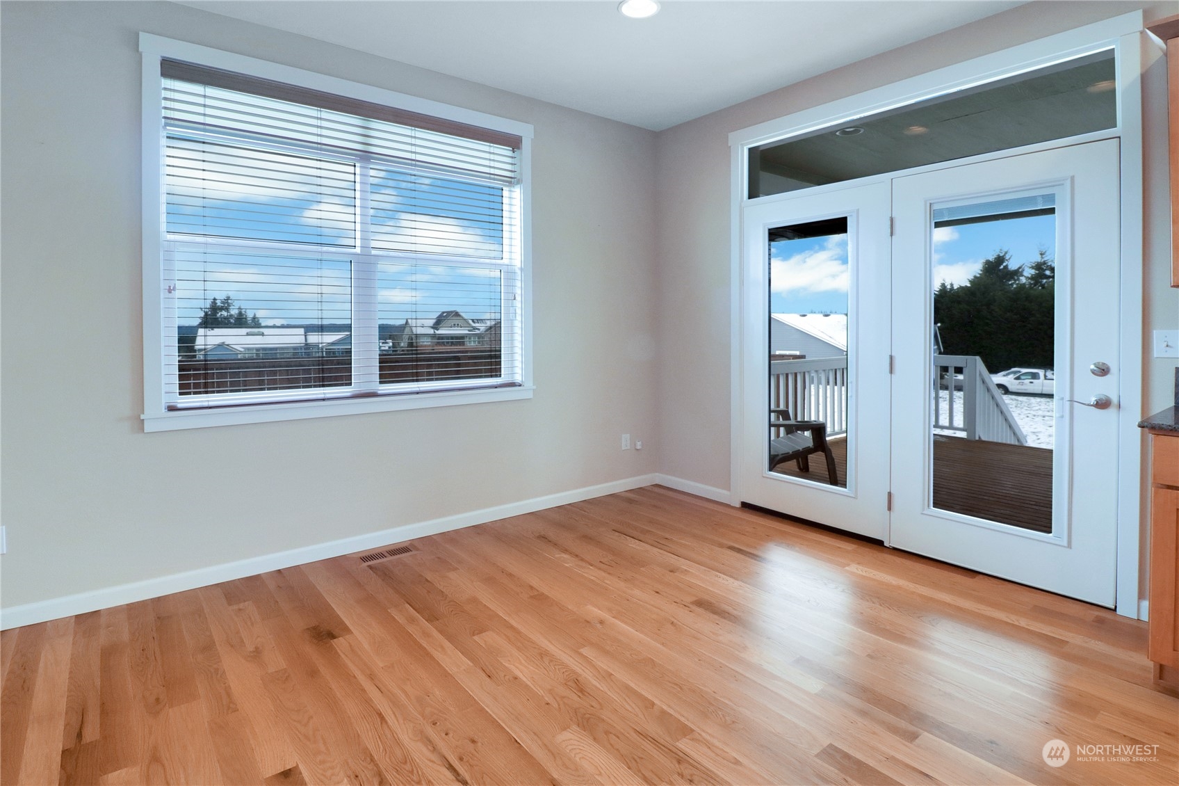 183 Garrett Loop Chehalis, WA 98532 - Photo 16 of 35 a view of an empty room with a window and wooden floor