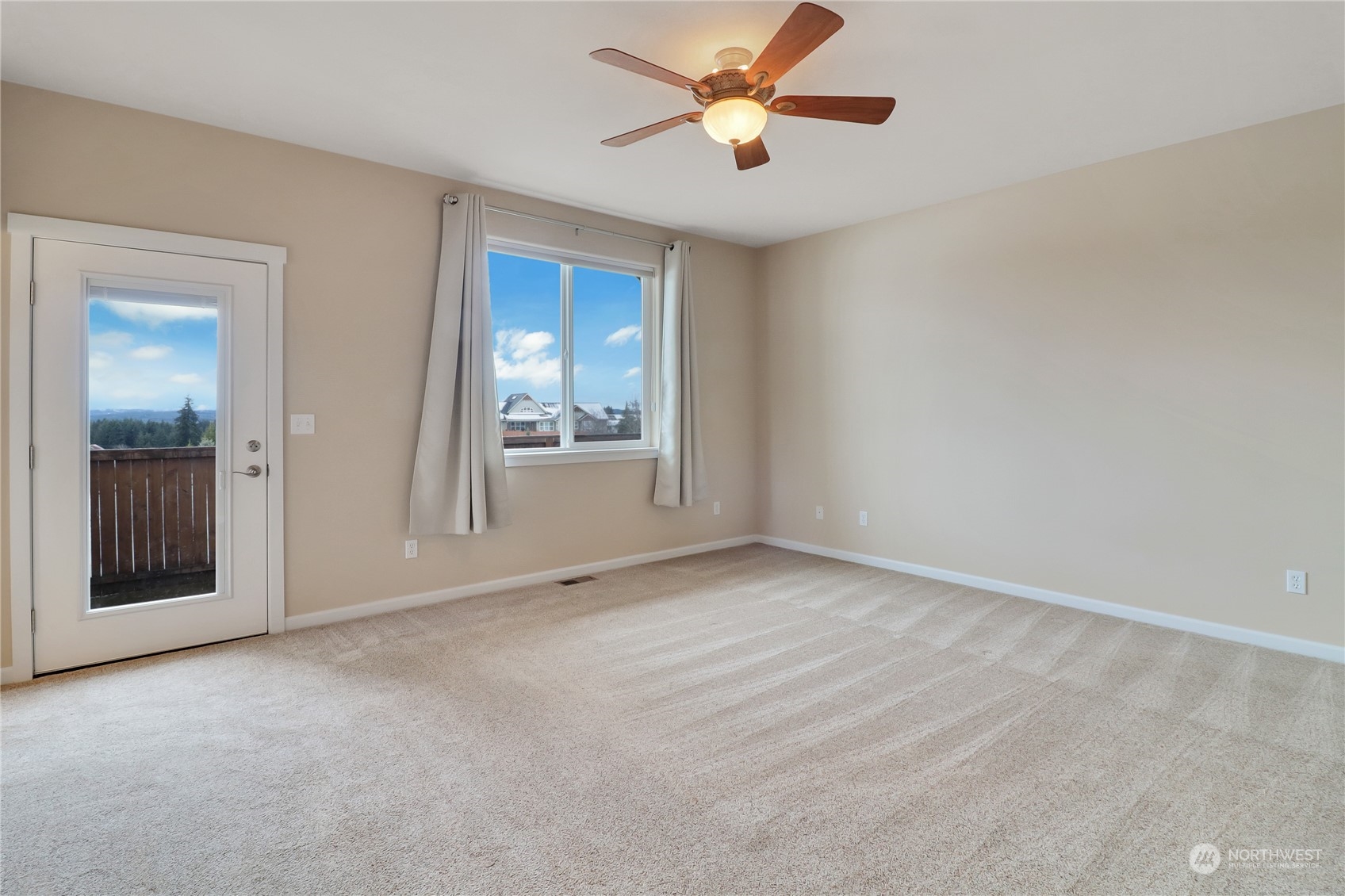 183 Garrett Loop Chehalis, WA 98532 - Photo 18 of 35 an empty room with chandelier fan and windows