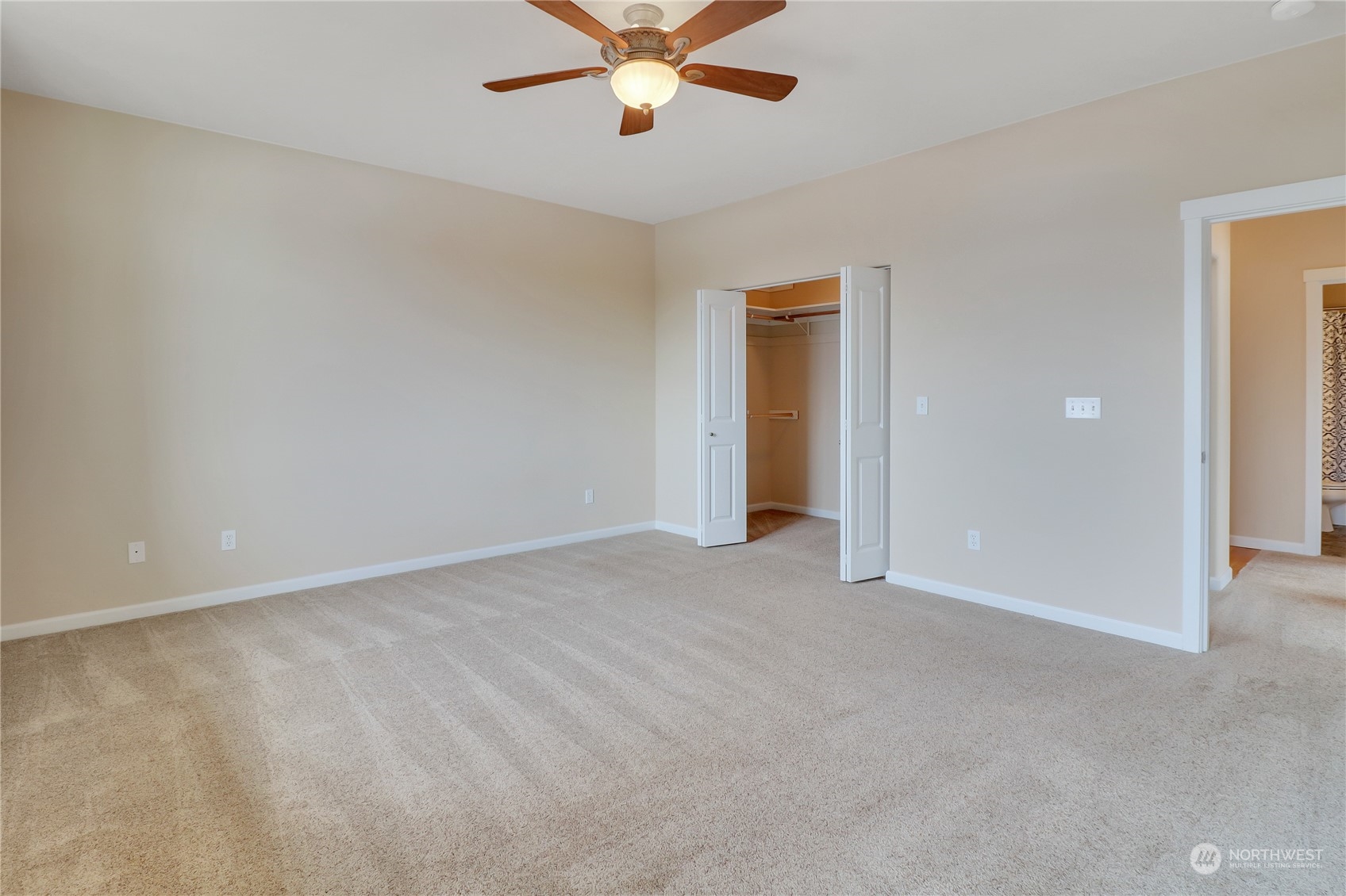 183 Garrett Loop Chehalis, WA 98532 - Photo 20 of 35 an empty room with closet and a ceiling fan