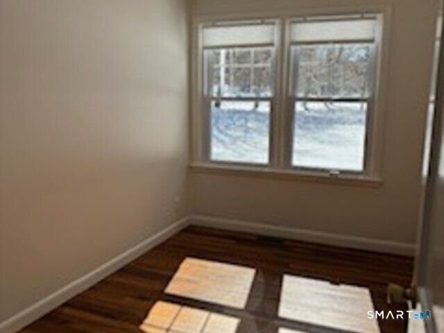 18 Buttonball Road Old Lyme, CT 06371 - Photo 14 of 20 a small space with wooden floor and a window