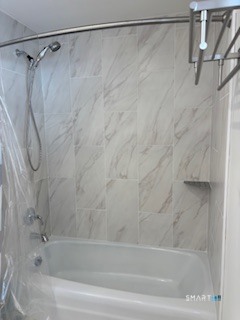 18 Buttonball Road Old Lyme, CT 06371 - Photo 18 of 20 a bathroom with a shower and a bath tub