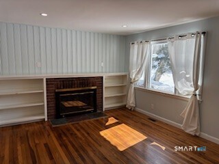 18 Buttonball Road Old Lyme, CT 06371 - Photo 10 of 20 a living room with a fireplace furniture and a window