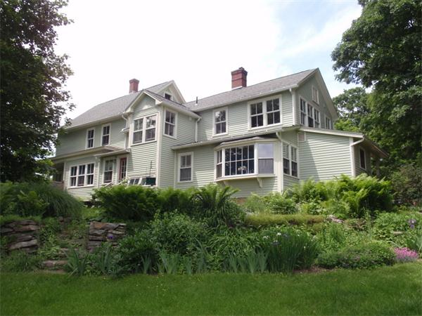 483 Montague Road Amherst, MA 01002 - Photo 1 of 30 a front view of a house with a yard
