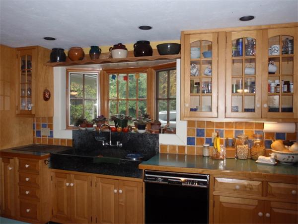 483 Montague Road Amherst, MA 01002 - Photo 5 of 30 a kitchen with granite countertop a sink and a stove
