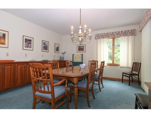 7 Evergreen Lane Hanover, MA 02339 - Photo 12 of 20 a view of a dining room with furniture and chandelier