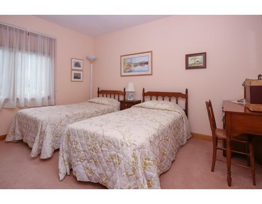 7 Evergreen Lane Hanover, MA 02339 - Photo 18 of 20 a bedroom with a bed and a table in it