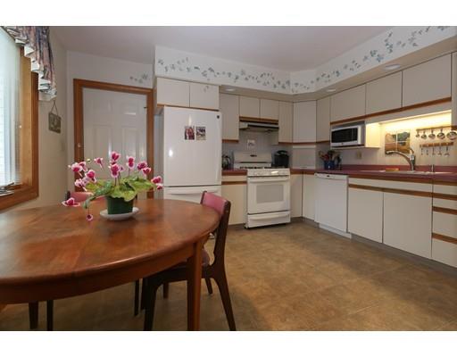 7 Evergreen Lane Hanover, MA 02339 - Photo 9 of 20 a kitchen with stainless steel appliances granite countertop a sink dishwasher and a refrigerator