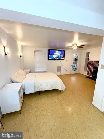 a bedroom with a bed and a couch