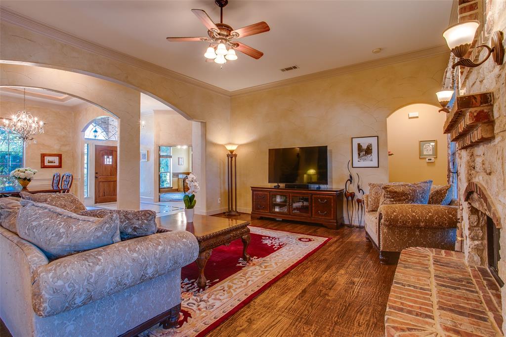 10044 Dennehy Drive Talty, TX 75126 - Photo 12 of 40 a living room with furniture and a flat screen tv