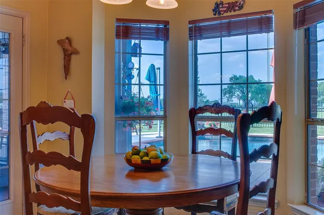 a view of a dining room with furniture and window