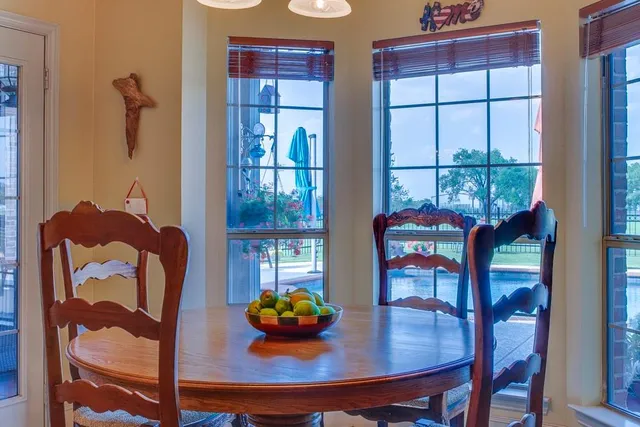 a view of a dining room with furniture and window