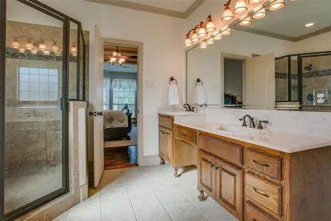 a bathroom with a sink double vanity and a mirror