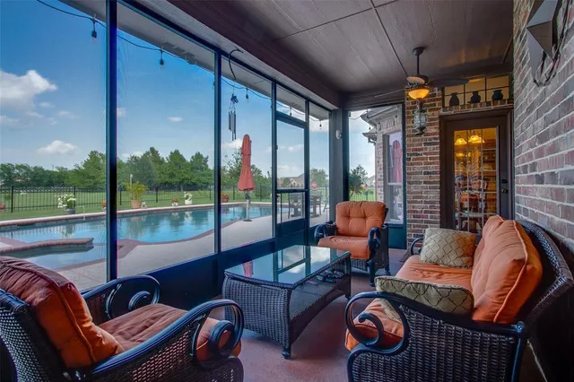 a outdoor living space with patio furniture and a fireplace