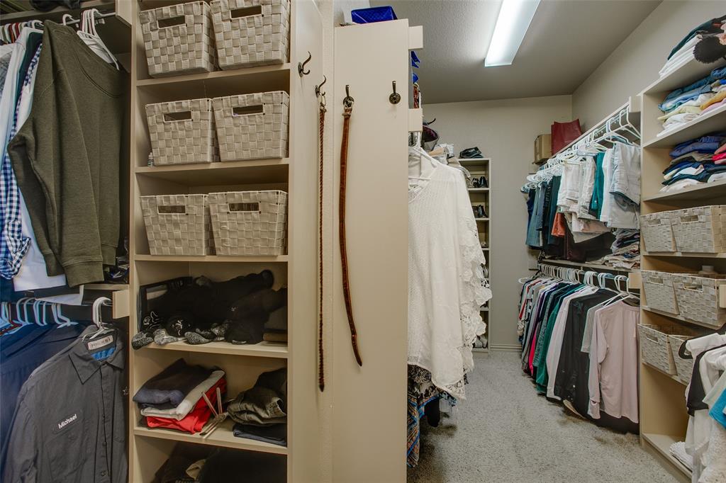 10044 Dennehy Drive Talty, TX 75126 - Photo 29 of 40 a view of walk in closet with clothes
