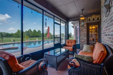 a outdoor living space with patio furniture and a fireplace