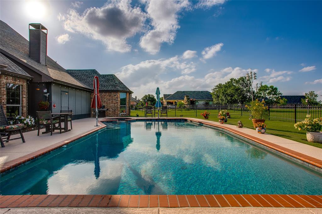 10044 Dennehy Drive Talty, TX 75126 - Photo 34 of 40 a view of swimming pool with outdoor seating and plants