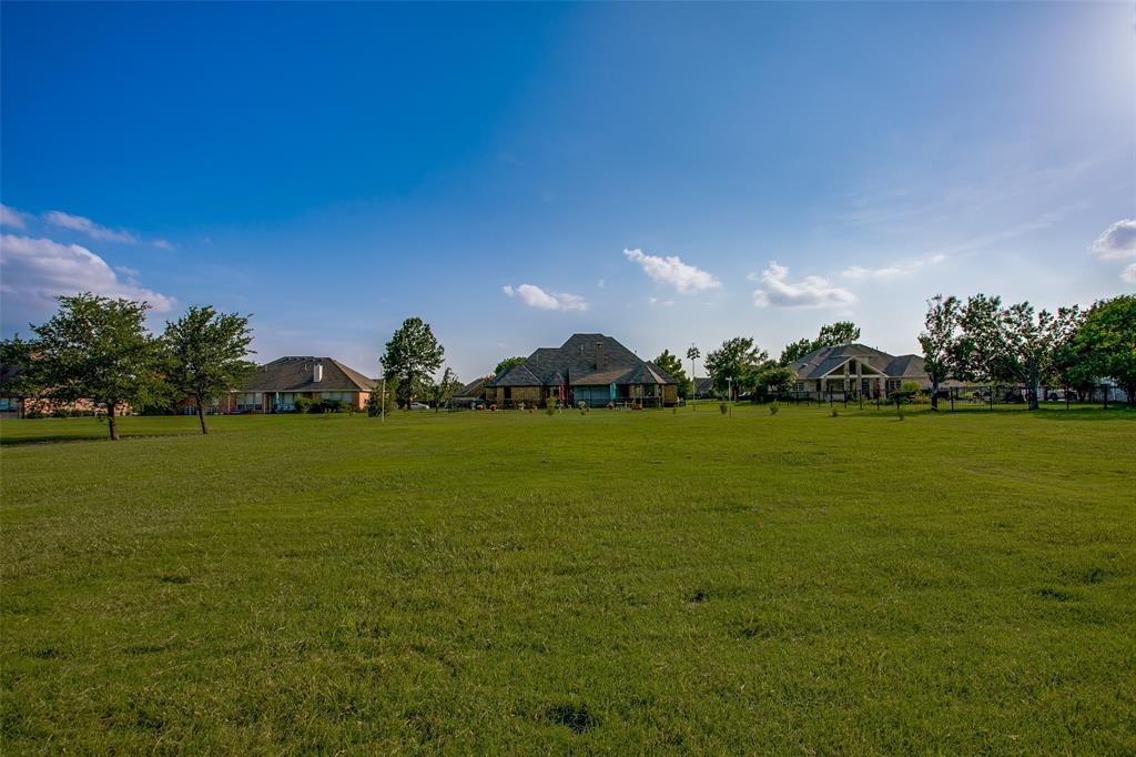 10044 Dennehy Drive Talty, TX 75126 - Photo 35 of 40 a view of a golf course with a lake