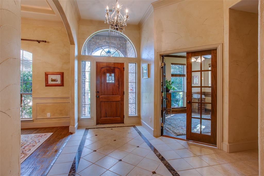 10044 Dennehy Drive Talty, TX 75126 - Photo 4 of 40 a view of a entryway door with chandelier