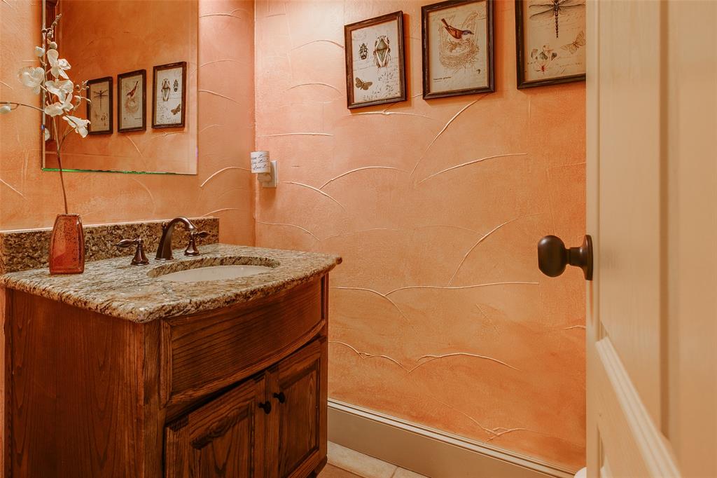 10044 Dennehy Drive Talty, TX 75126 - Photo 6 of 40 a sink and a mirror