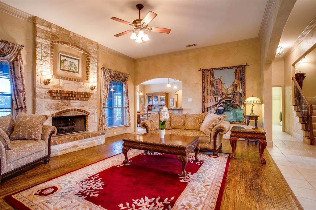 10044 Dennehy Drive Talty, TX 75126 - Photo 10 of 40 a living room with furniture fireplace and a table
