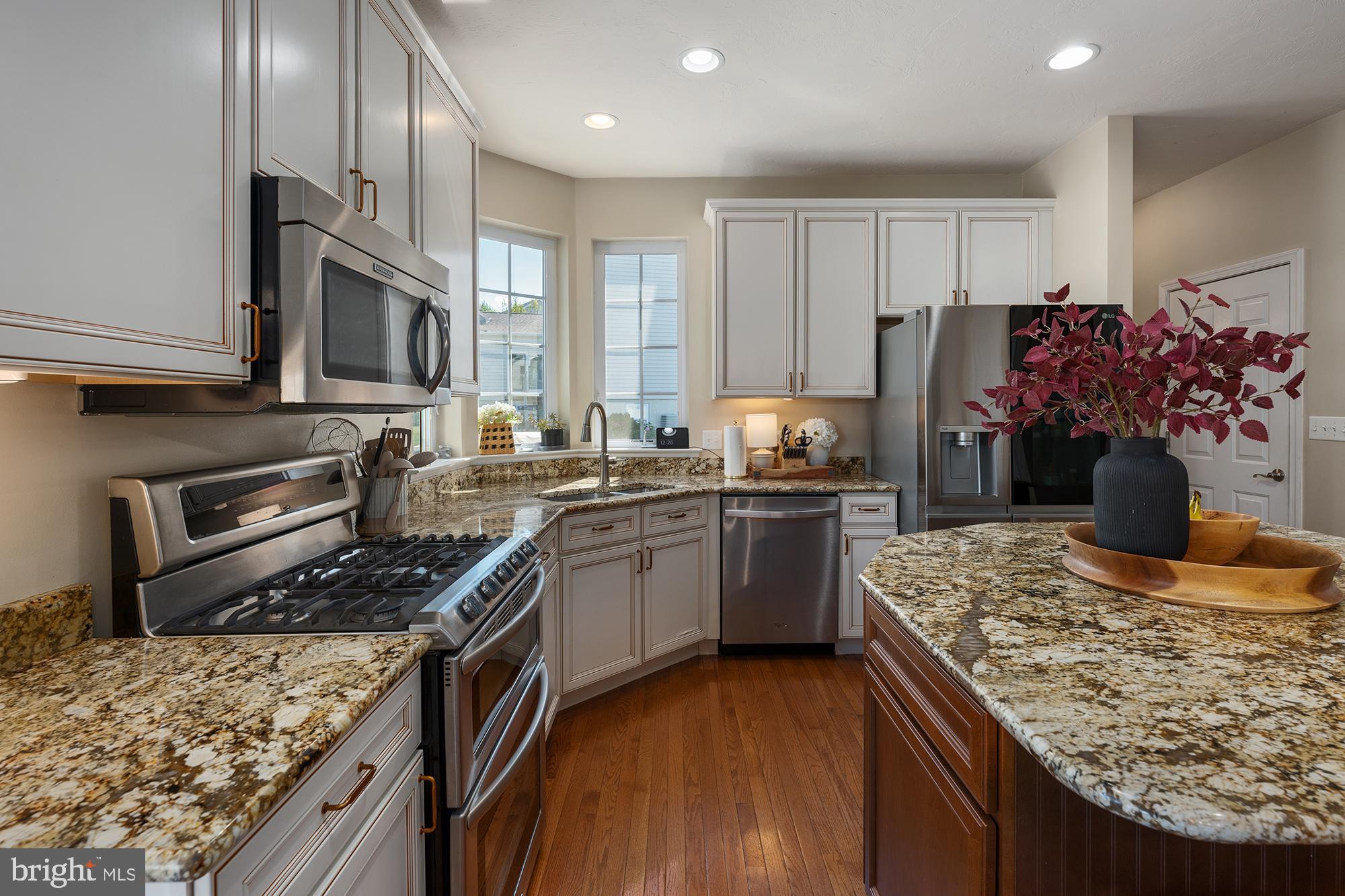 12 Boulder Road Hanover, PA 17331 - Photo 11 of 61 a kitchen with stainless steel appliances kitchen island granite countertop a stove refrigerator sink and cabinets