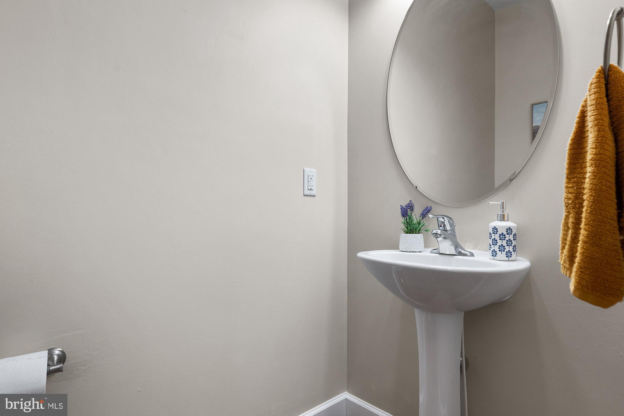 12 Boulder Road Hanover, PA 17331 - Photo 27 of 61 a bathroom with a sink a mirror and a wooden floor