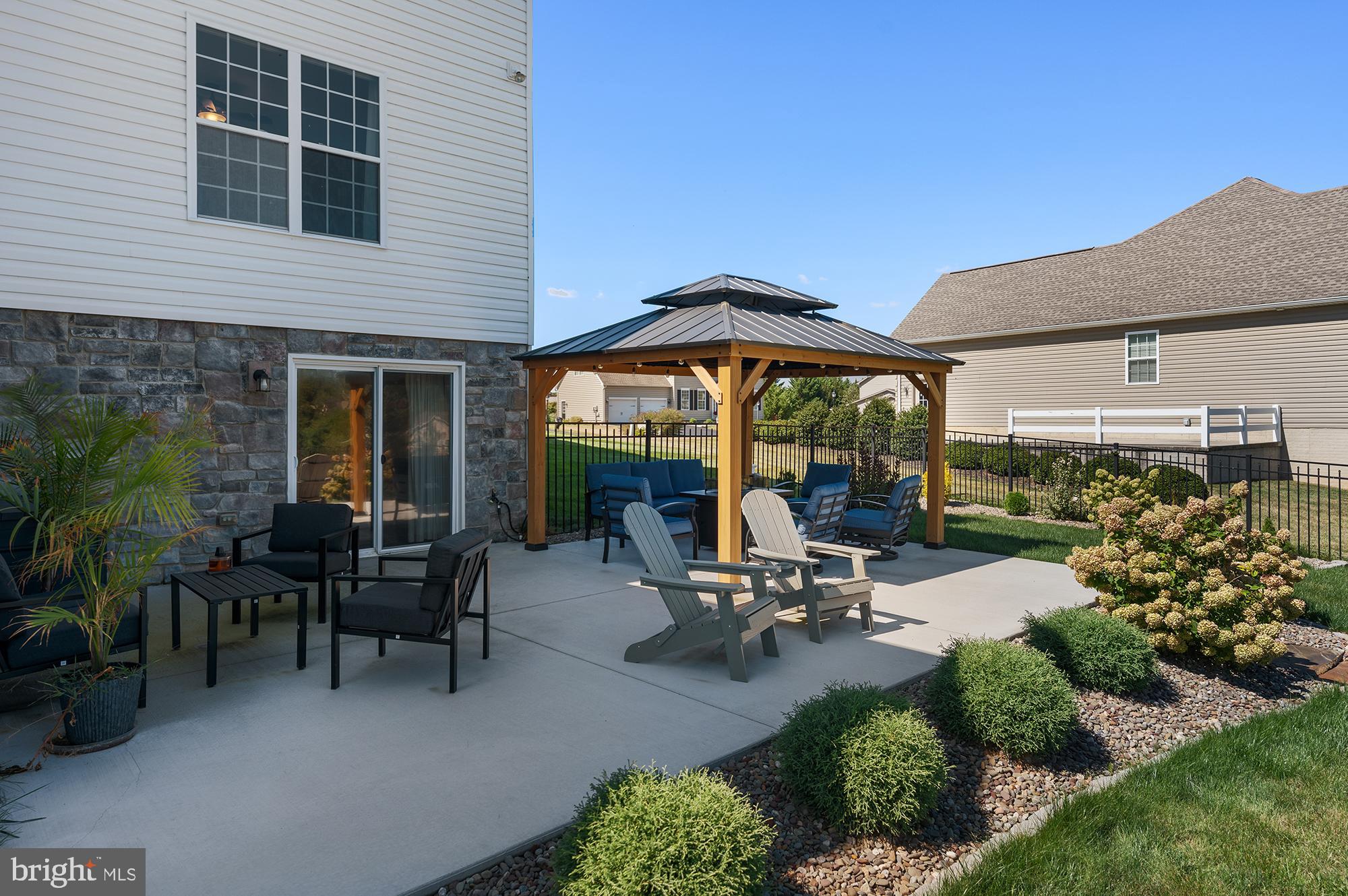 12 Boulder Road Hanover, PA 17331 - Photo 49 of 61 a view of a patio with table and chairs under an umbrella