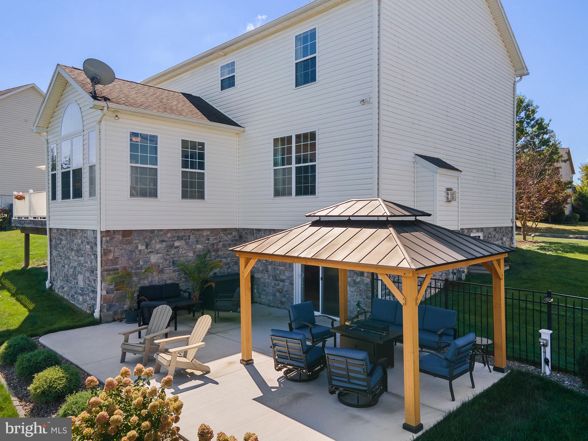 12 Boulder Road Hanover, PA 17331 - Photo 53 of 61 a patio with a table and chairs under an umbrella