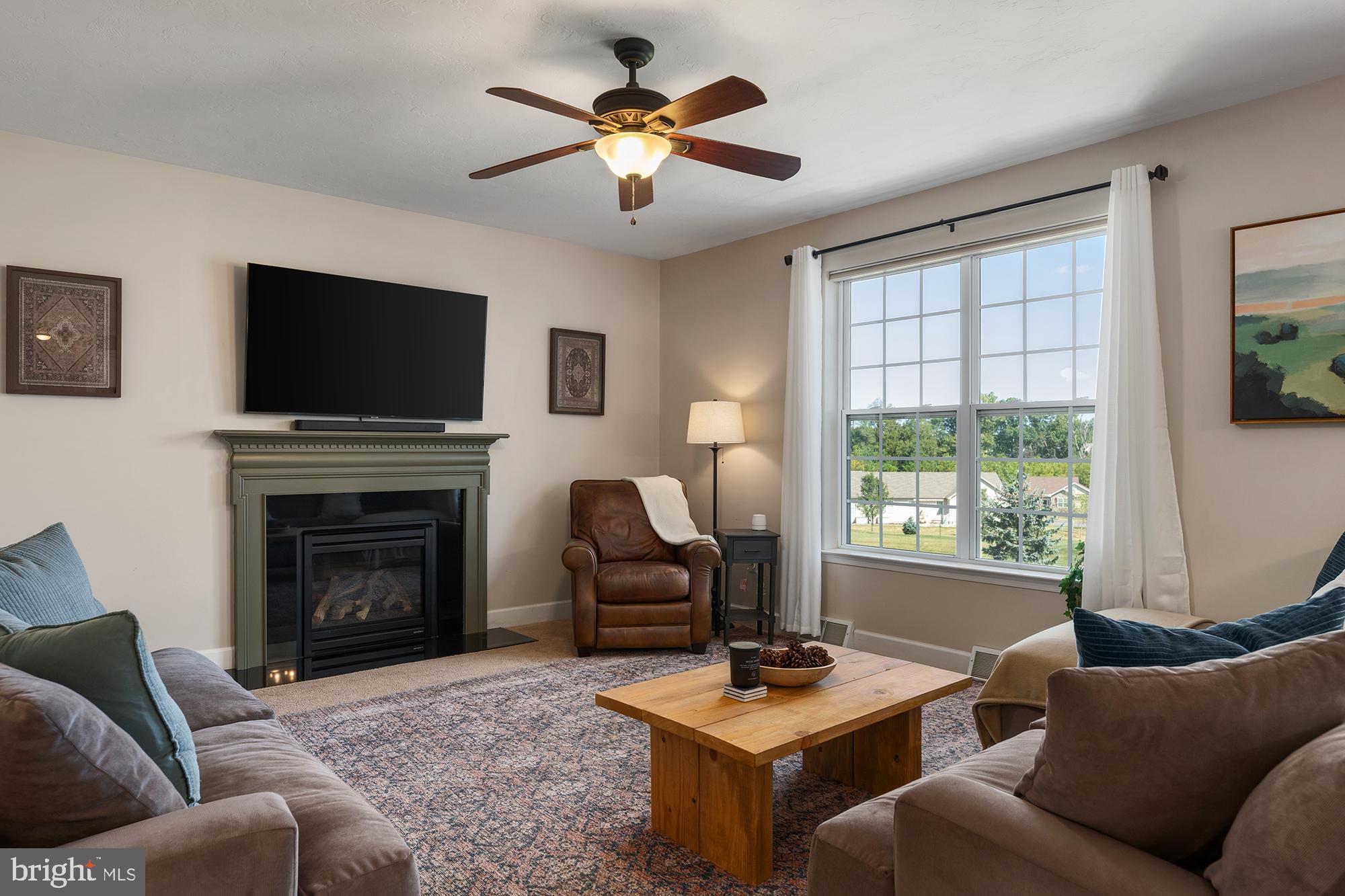 12 Boulder Road Hanover, PA 17331 - Photo 8 of 61 a living room with furniture a fireplace and a flat screen tv